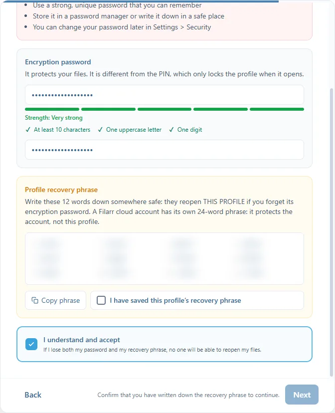 The Security & encryption step of a local profile: the encryption password typed twice with its strength meter, the 12-word profile recovery phrase, blurred here, with Copy phrase and its confirmation box, and I understand and accept
