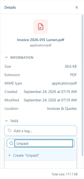 The Details panel of an invoice: the Information section, then Tags with the search field "Unpaid" and the line Create "Unpaid"