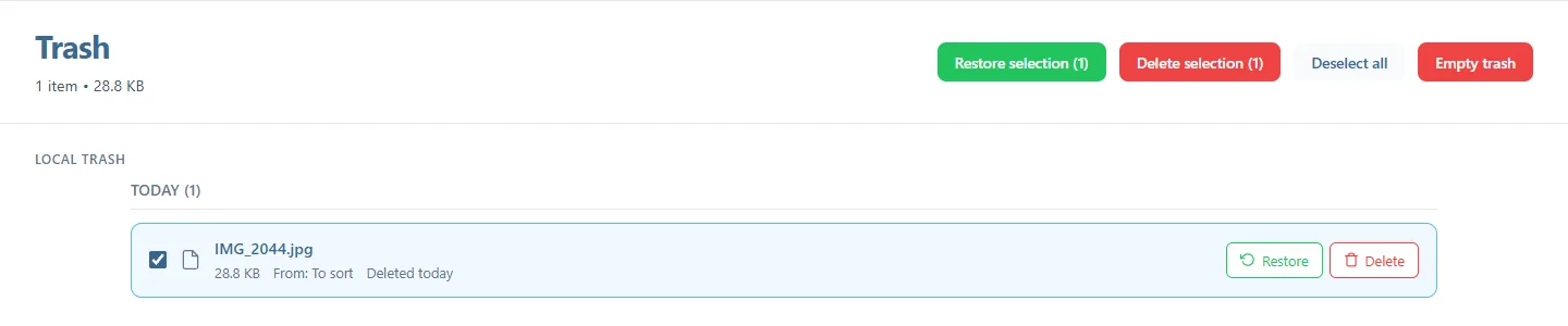 The Trash page with one item ticked, and the Restore selection (1), Delete selection (1), Deselect all and Empty trash buttons at the top