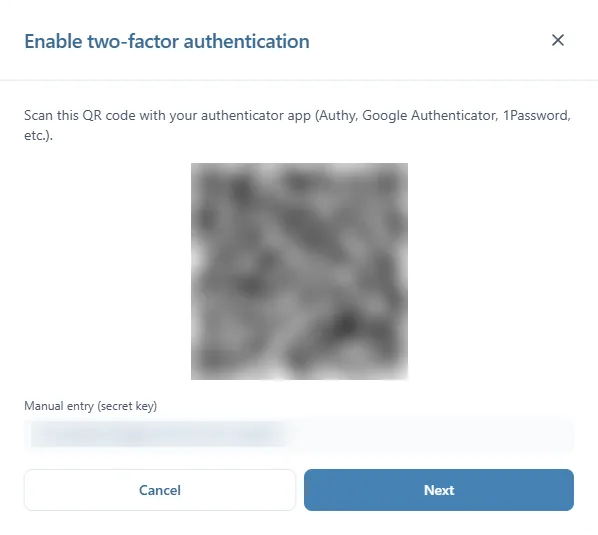 The first step of Enable two-factor authentication: the QR code to scan and the Manual entry (secret key) box, both blurred here, then Cancel and Next